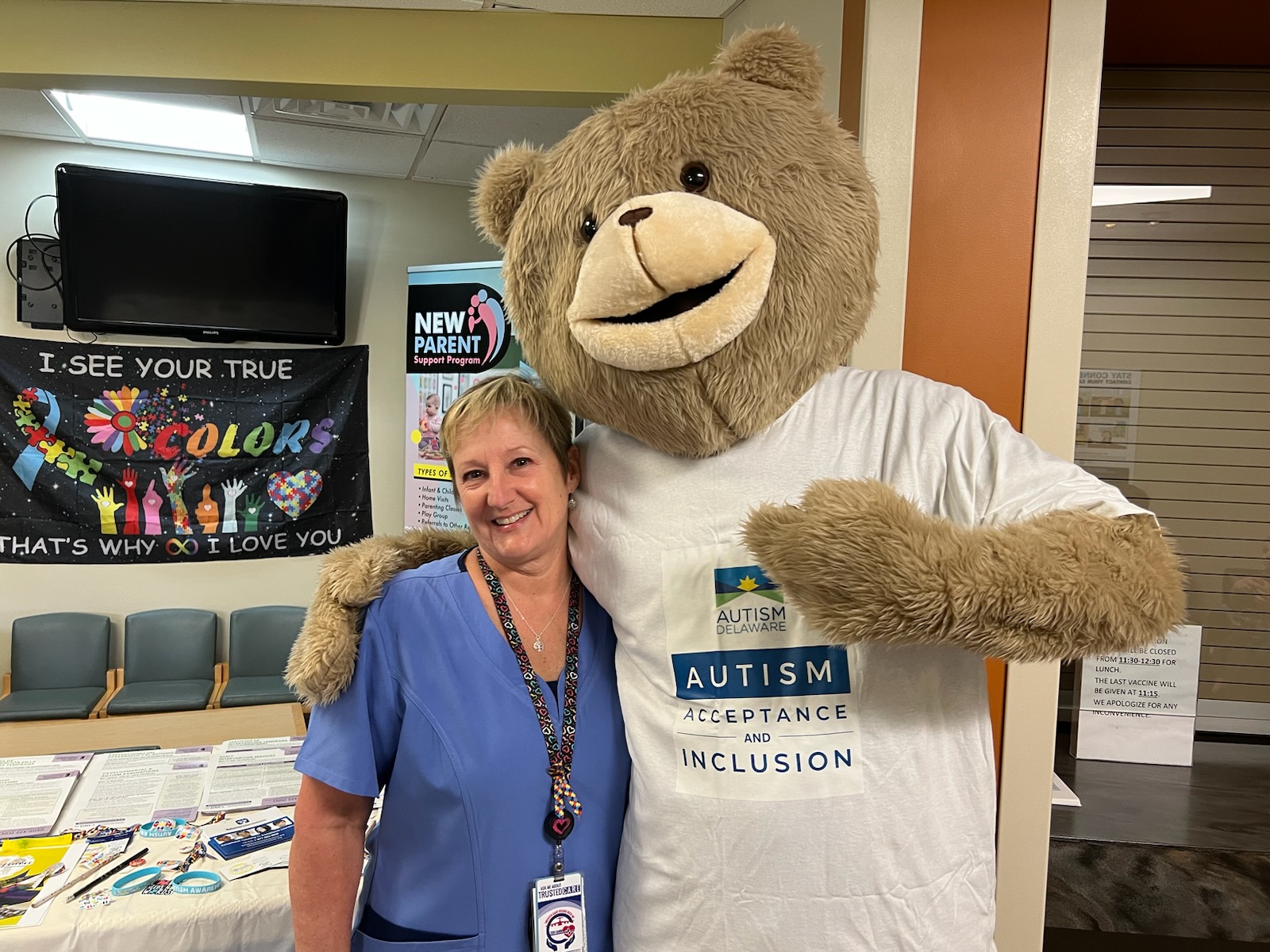 Nurse Dawn Brock hugs Alex the Bear.